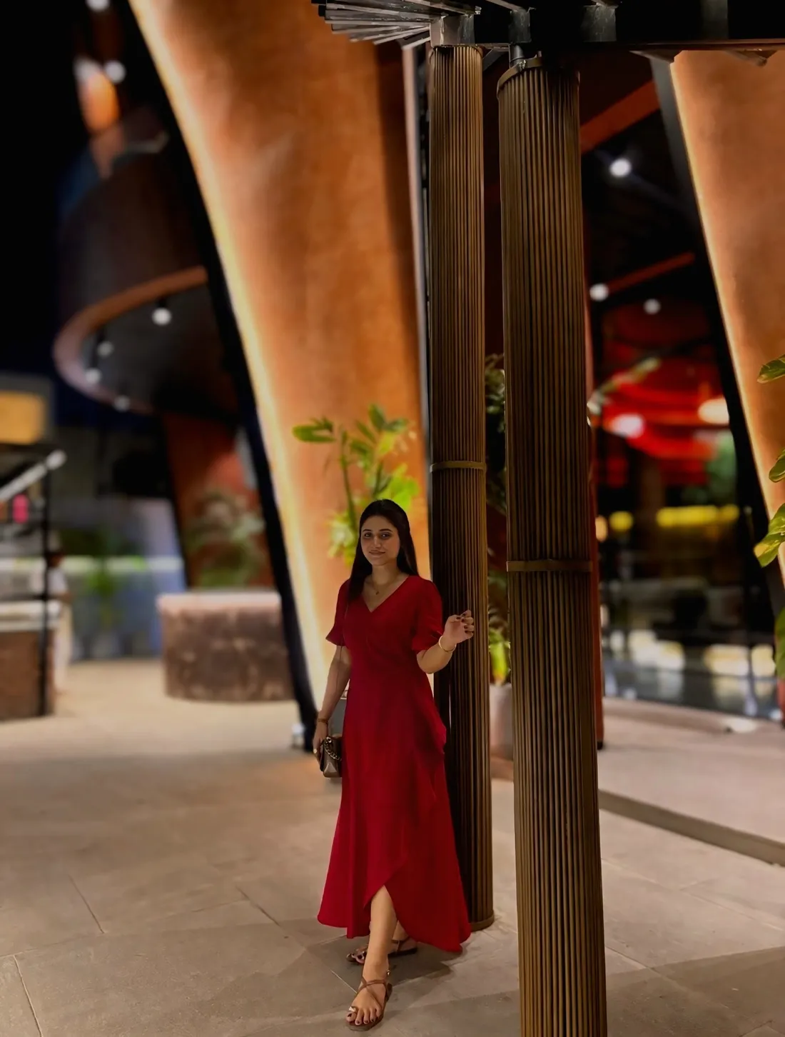 Guest beside the sculpted terracotta arches