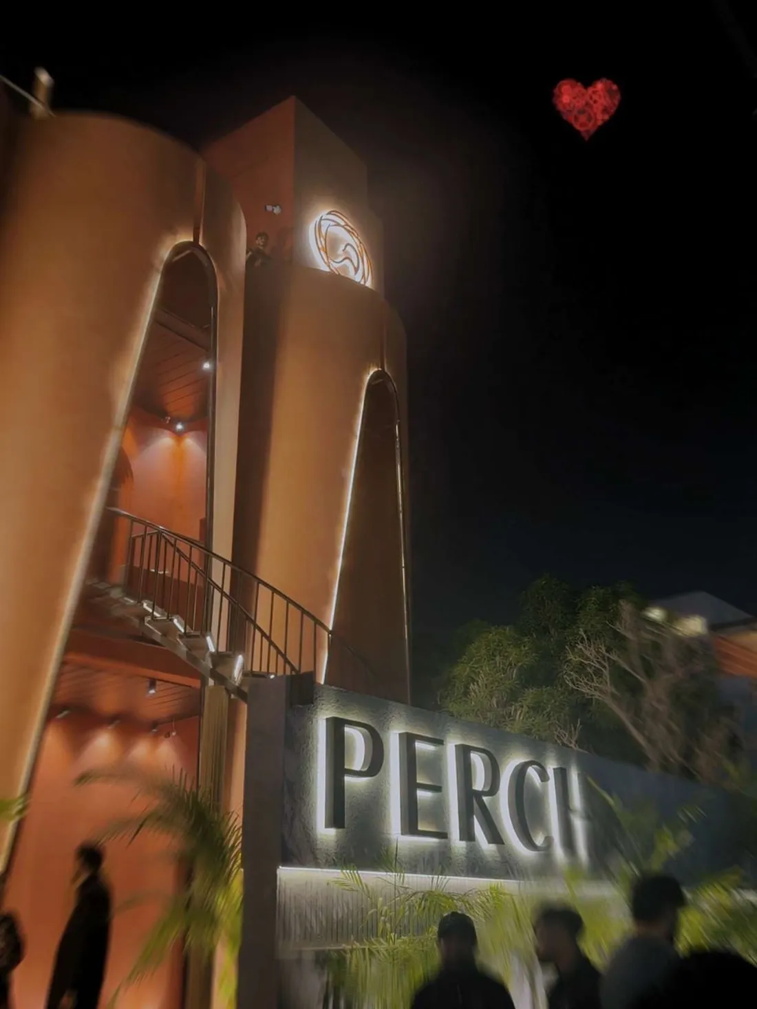 Perch's facade from the street at night