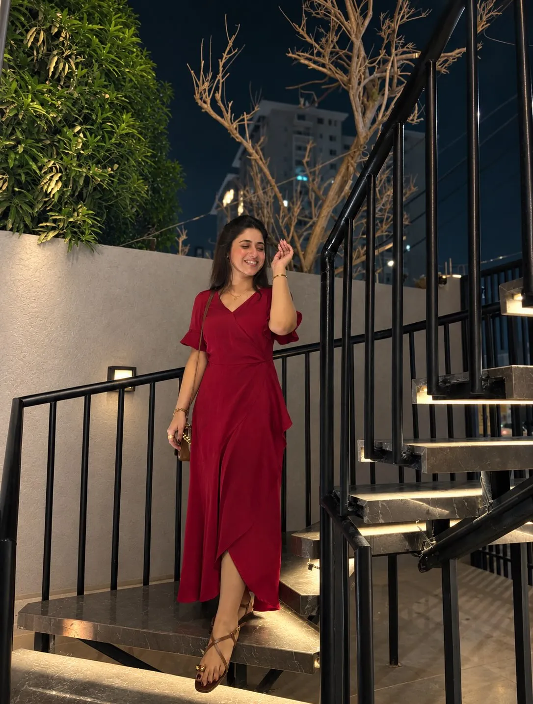 Guest on the lit staircase at night
